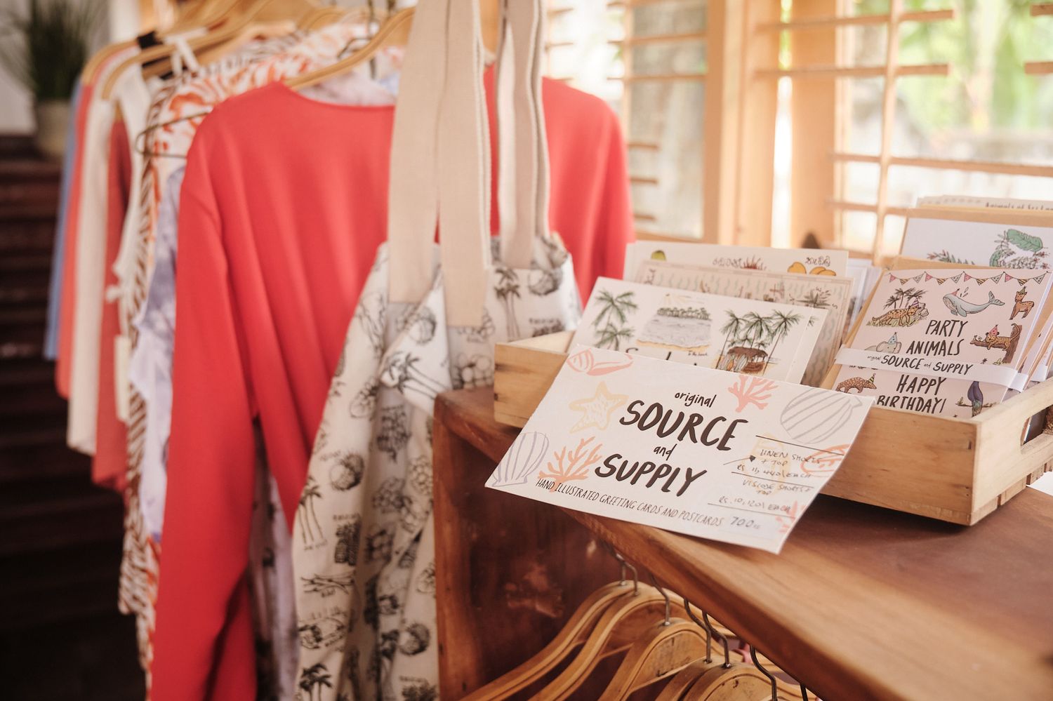 Hand-illustrated cards and tote bags in the shop